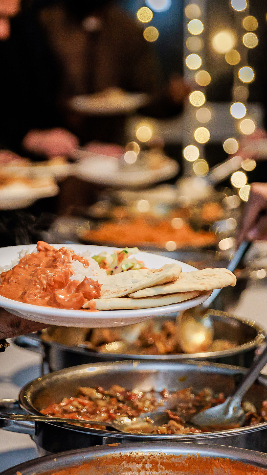 Grand wedding buffet setup with a variety of gourmet dishes to impress guests.
